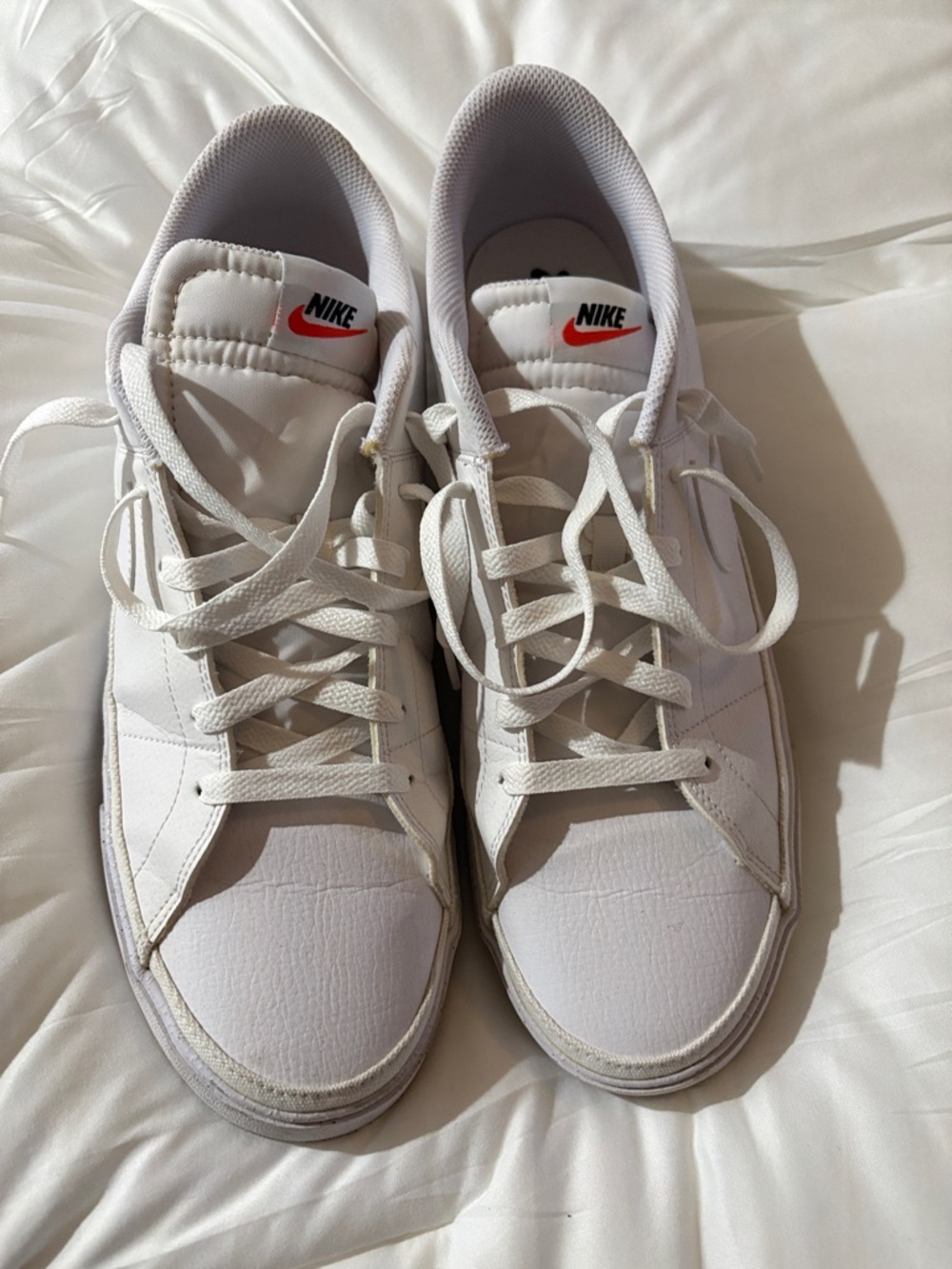 Nike White Low-Top Sneakers with Red Swoosh Accent